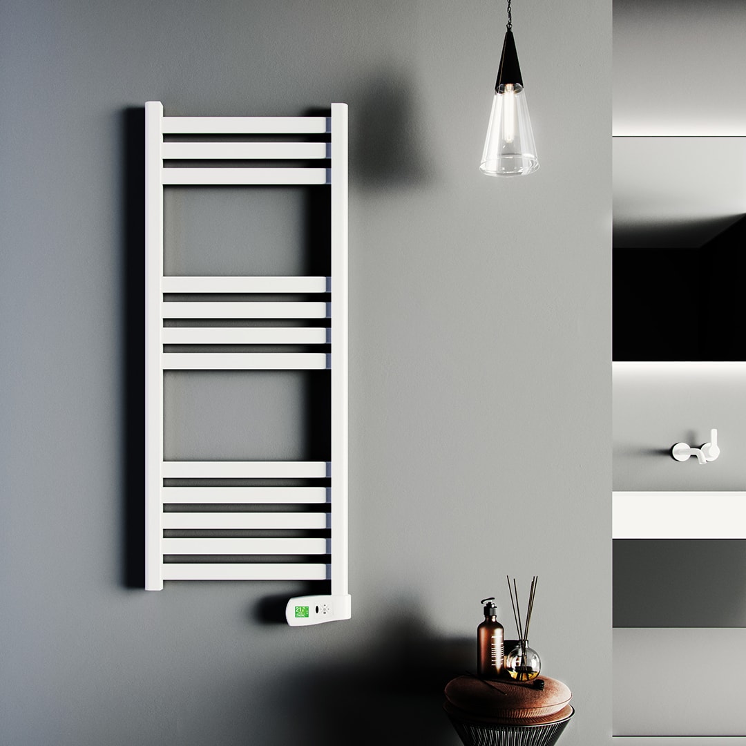 Kyros electric towel rail in white wall mounted in a grey bathroom