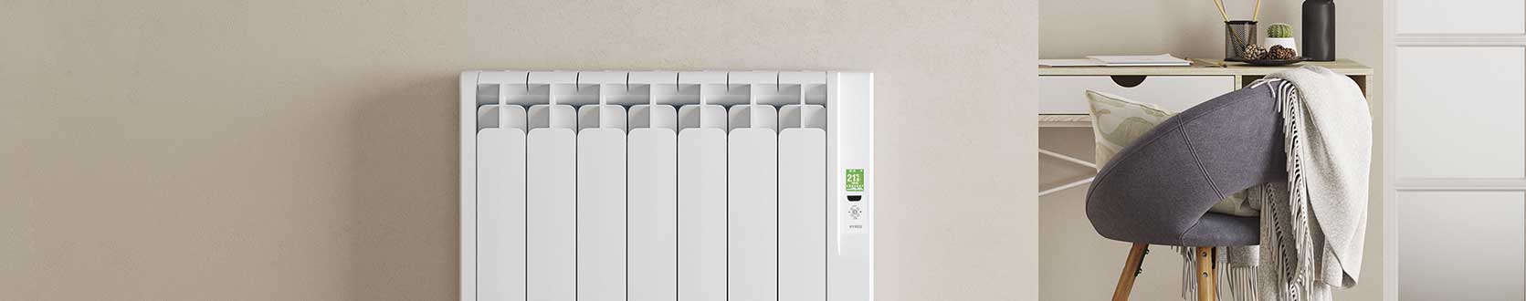 Rointe Kyros smart timer electric radiator in white wall mounted in living room