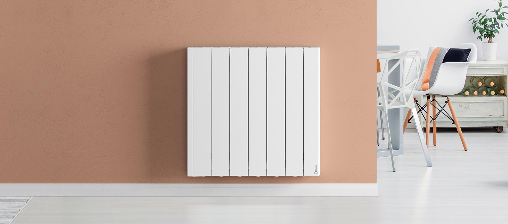 Rointe aluminium oil filled Belize basic wifi radiator in white wall mounted in living room